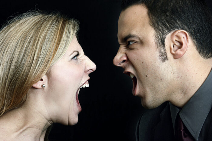 Couple arguing in each other's faces